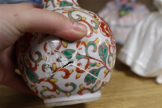 A Chinese blue and white large tripod censer, a peach bloom brush washer and a famille verte vase